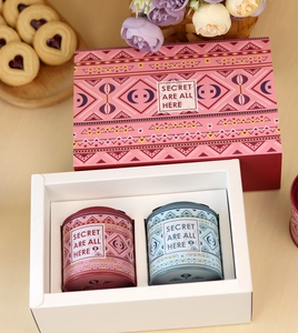 Pink gift set with bohemian style metal tin cans for loose tea or candy storage