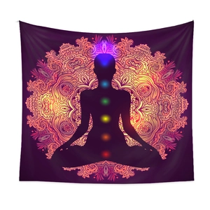 Detail of a meditation tapestry featuring chakra points and a golden mandala design