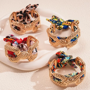 Golden mesh metal cuff bracelets wrapped in colorful printed fabrics, 4-piece set