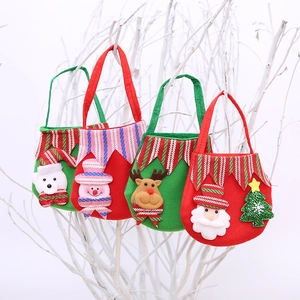 Christmas felt gift bags with Santa and Reindeer hanging on white decorative branches