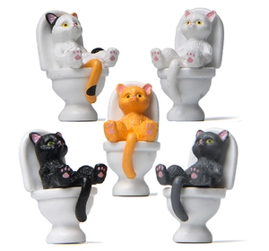 Set of five assorted resin cat figurines sitting on miniature toilets for desk decor