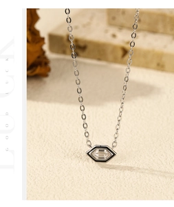Macro detail of S925 silver hexagonal eye pendant with black enamel and rectangle zircon