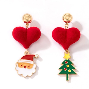 Macro shot of asymmetric Christmas earrings with red heart and Santa Claus charms