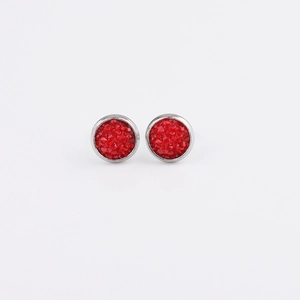 Close-up of 8mm stainless steel stud earrings with red textured druzy inlay on white background