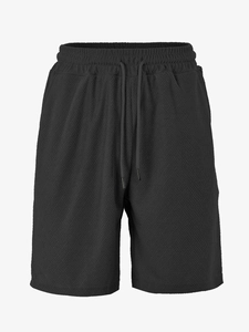 Detailed macro view of black waffle texture fabric and drawstring on men's casual shorts