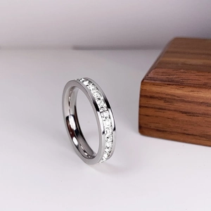 Eternity band ring with square-cut cubic zirconia in a silver-tone channel setting