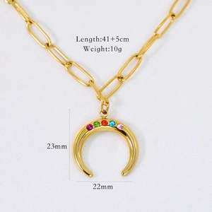 Detail of 14K gold plated crescent pendant with colorful cubic zirconia and paperclip chain