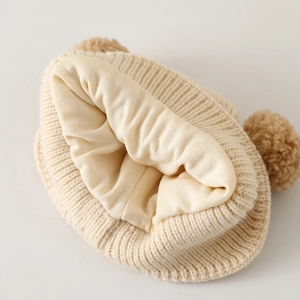 Detail showing the soft cotton lining and ribbed knit texture of baby bear ear hat