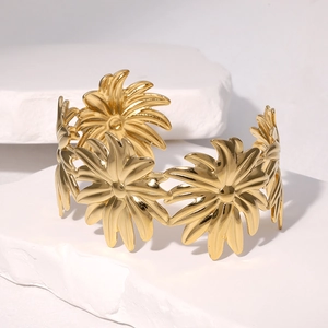 Gold daisy petal cuff bracelet in polished stainless steel with an open C-shape design
