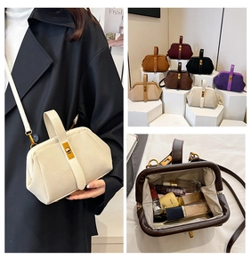 Detail view of multi-color shell bags with metal frame closure and adjustable straps