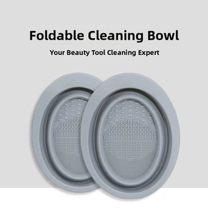 Macro view of foldable grey silicone cleaning bowl with multi-textured bottom for brushes