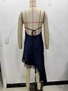 Detailed back view of navy satin dress with cross straps and black eyelash lace trim