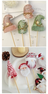 Detail of Christmas felt gift tags including glitter hats and knitted plush elves dolls
