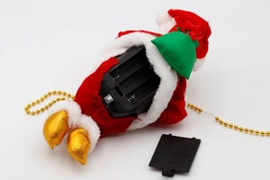 Detail showing the internal battery compartment for 3xAA batteries in Santa plush toy