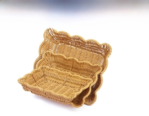 Three-piece stackable hand-woven fruit baskets with wavy edges in imitation rattan