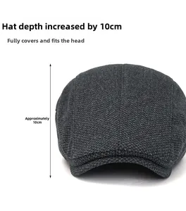 Detailed view of dark grey newsboy cap showing 10cm depth and knitted wool texture