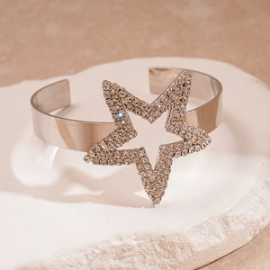Detailed macro view of silver star cuff bracelet with sparkling crystal pavé settings