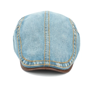 Vintage washed denim ivy cap with brown leather brim and contrast stitching for a retro look