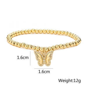 Detailed view of gold-plated dragonfly butterfly charm with 1.6cm dimensions and 12g weight