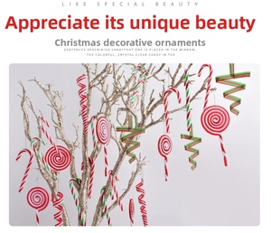 Detail of red and green candy cane ornaments hanging on a festive Christmas tree branch