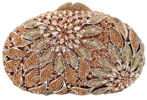 Macro shot of champagne gold floral rhinestone pattern on luxury metal clutch bag