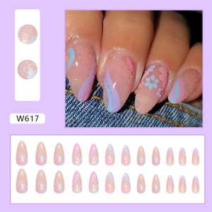 Sparkling almond press-on nails with floral patterns and colorful glitter gradient design
