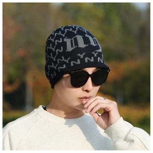 Detail of warm winter knitted hat with fleece lining and ear protection for men