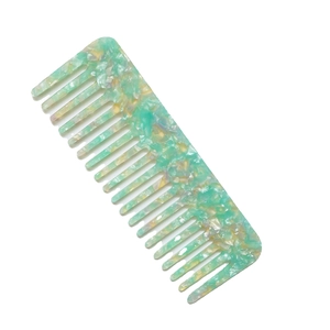 Elegant wide-tooth hair comb featuring green and white marble acetate patterns