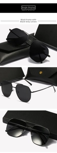 Detail view of aviator sunglasses with black metal frame and polarized lenses for driving