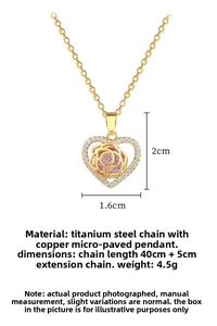 Detail of rose gold heart necklace featuring a pink stone and crystal-encrusted border