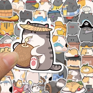 Close-up of cute waterproof cartoon cat stickers for laptops and journals held by hand