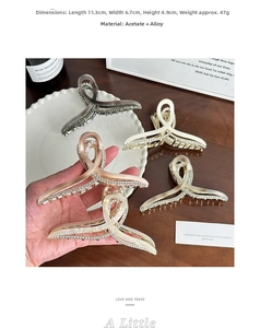 Detail view of a large acetate shark hair claw showing 11.3cm size dimensions and crystals