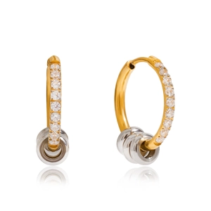 Detail of two-tone gold and silver earrings with inlaid crystal stones and metallic rings