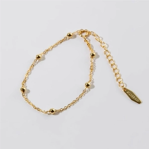 Detailed view of S925 sterling silver beaded chain bracelet in golden finish