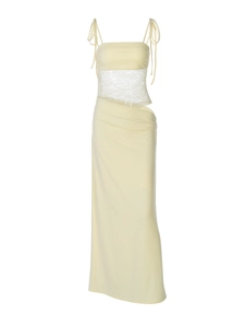 Close-up of pale yellow two-piece set with white lace cutout detail on the waistline