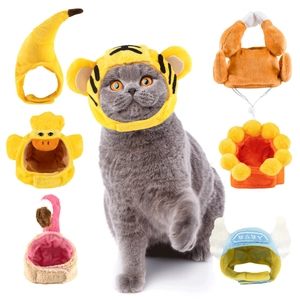 Detail showing various plush pet hat styles including tiger and banana on a cat