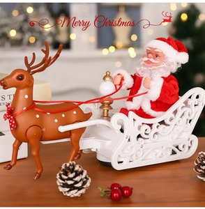 Detailed electric Santa Claus and reindeer sleigh toy on a festive wooden surface