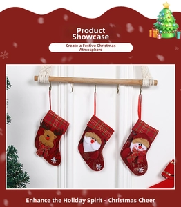 Detailed view of three hanging Christmas stockings with Santa, reindeer, and snowman designs