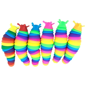 Detailed view of six colorful rainbow slug fidget toys arranged on a white background
