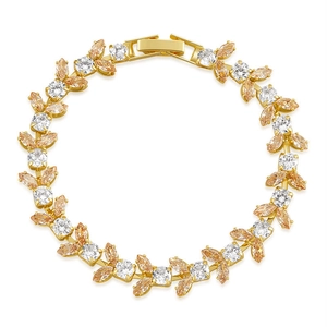 Detailed view of gold bracelet featuring champagne marquise and white round cubic zirconia