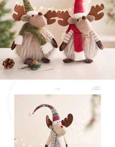 Close-up of plush Christmas reindeer decor featuring knitted hats and striped scarves