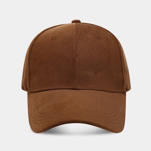 Detailed view of brown twill cotton baseball cap with ventilation holes and stitching