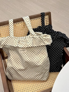 Polka dot canvas tote bag with ruffle trim in cream and black for daily commute