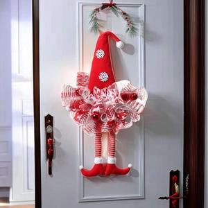 Christmas elf legs door wreath with red and white snowflake pattern ribbon and mesh