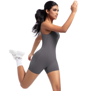 Close-up of deep gray athletic bodysuit showing flexible stretch and slim fit design