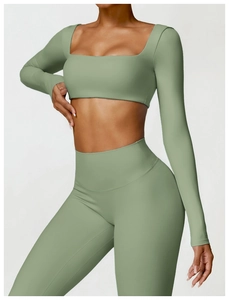 Detail of sage green long sleeve yoga top with square neck and thumbhole sleeve cuffs