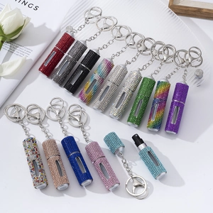 Portable refillable rhinestone perfume bottles with keychains in various vibrant colors