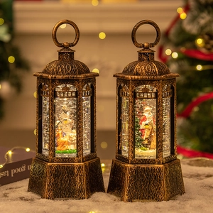 Bronze vintage Christmas lanterns with Nativity scene and Santa Claus in snowy setting