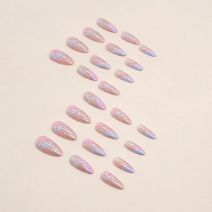 Almond press-on nails featuring pink glitter, blue floral patterns and wavy lines