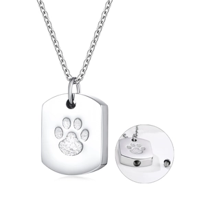 Detail of silver stainless steel dog paw urn pendant showing screw opening at the bottom